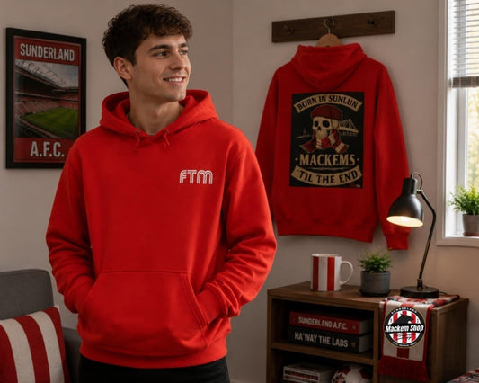 A man wearing a bright red hoodie with a white 'FTM' logo on the chest stands in a room, while a matching red hoodie hangs on a wall behind him with a large vintage-style football graphic reading 'BORN IN SUNLUN MACKEMS TIL THE END'.