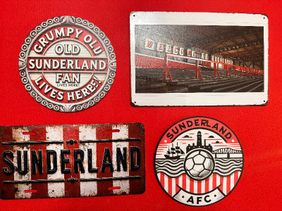 Collection of Sunderland AFC related metal signs on a red background