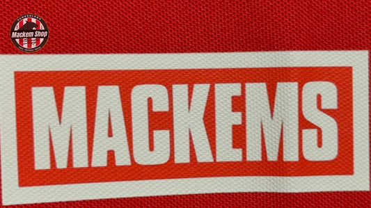 Red fabric with 'MACKEMS' text on a red background