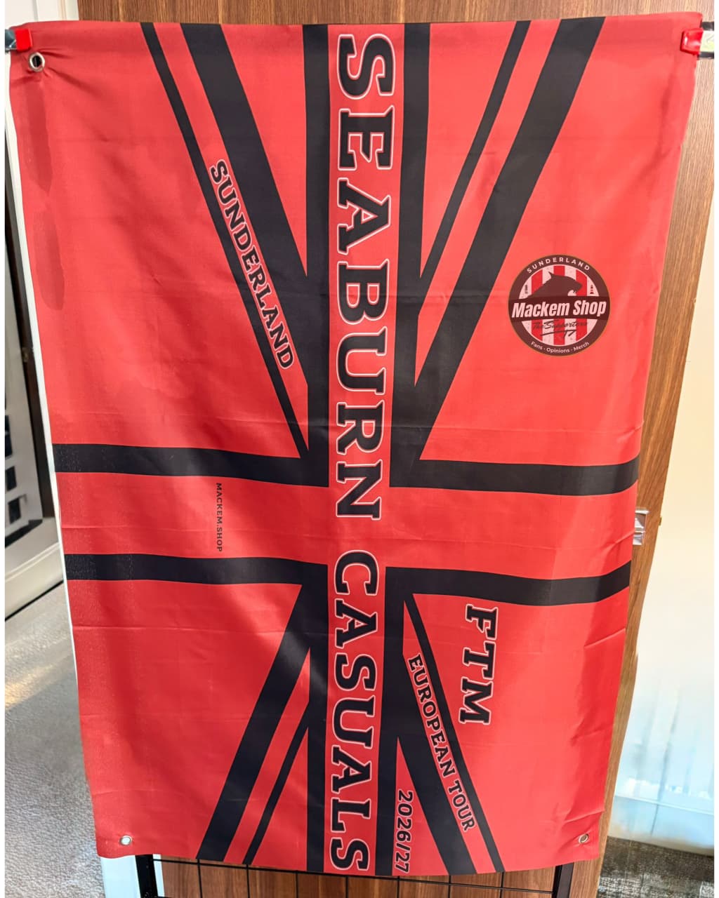 Red and black flag with 'Seaburn Casuals' branding and a Union Jack design.