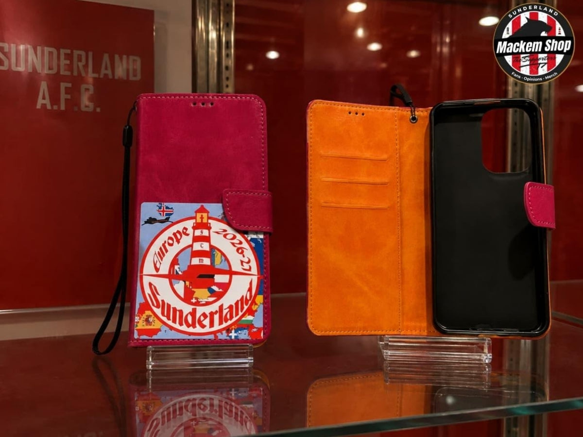 Two folio phone cases displayed on a glass shelf in a store. The left case is closed and features a bright pink exterior with a Sunderland European tour theme.