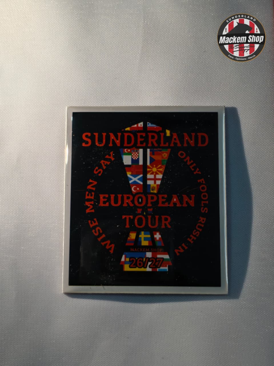 Fridge magnet with Sunderland text and graphics on a metallic surface