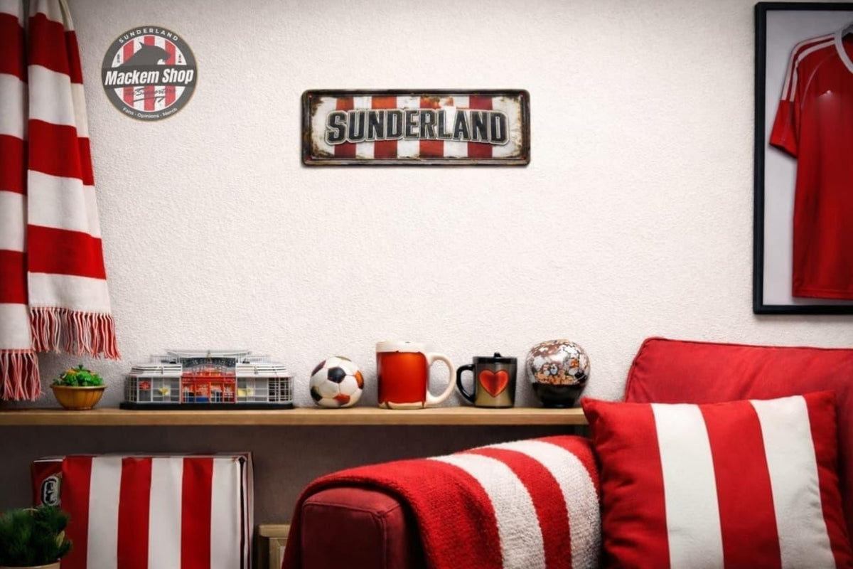 A Sunderland football club themed room scene featuring a red and white striped wall sign, a red and white striped pillow, a red and white striped throw blanket, a red and white striped scarf, a framed red jersey, and a Mackem Shop logo sticker.