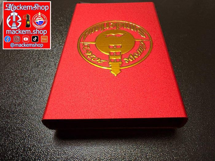 A red RFID Card Wallet with a metallic gold foil emblem on the front, photographed on a dark textured surface. A 'Mackemshop' logo overlay is visible in the top-left corner.