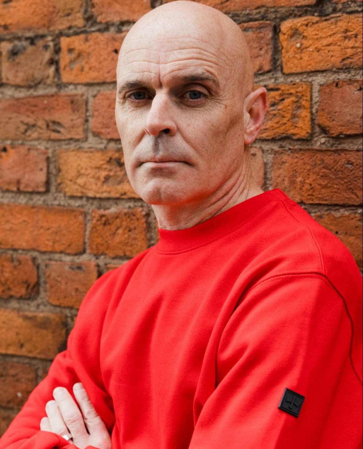 Man wearing a Terrace Cult red sweatshirt by Mackem Shop.
