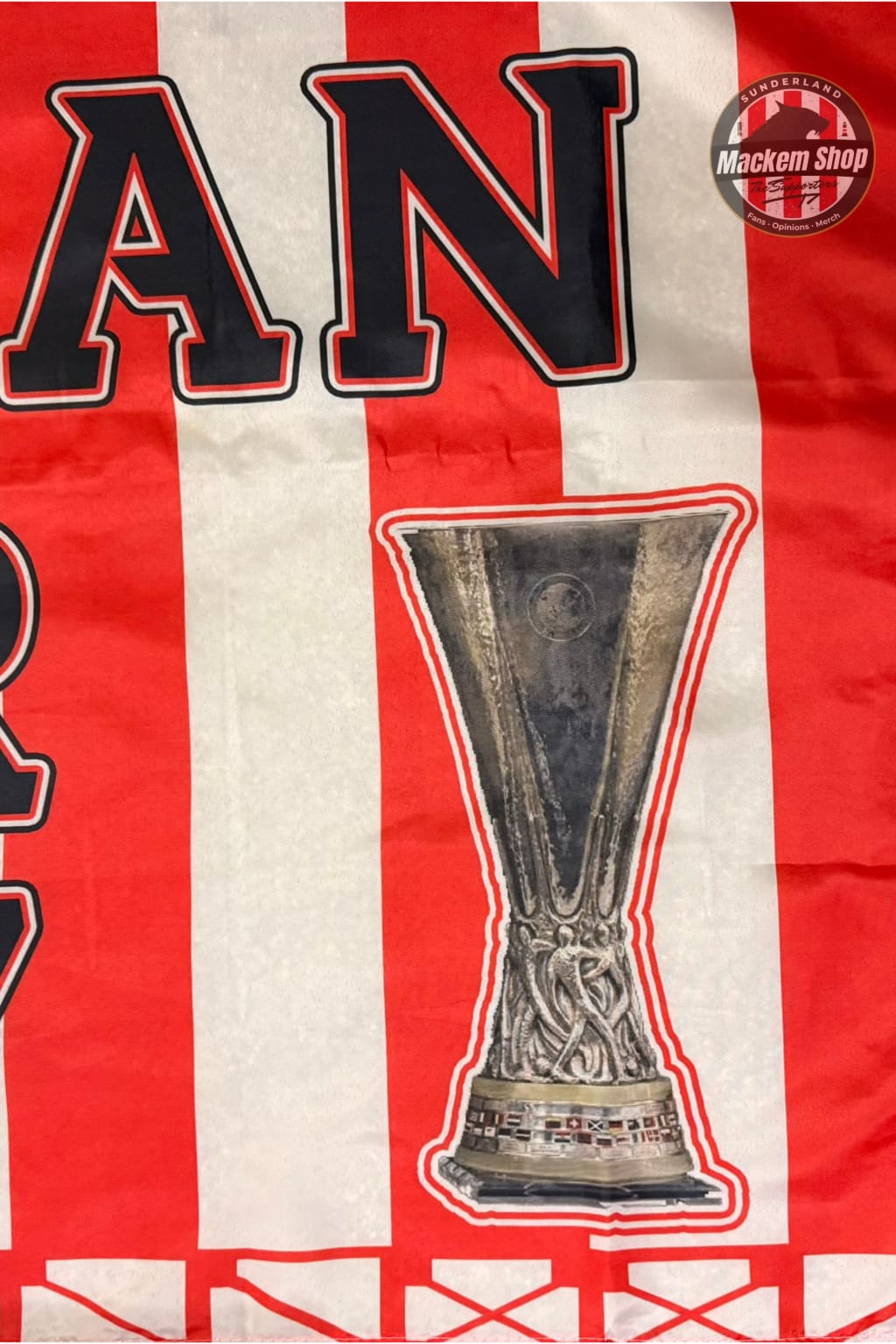 Red and white striped banner with a trophy graphic and 'Mackem Shop' logo.
