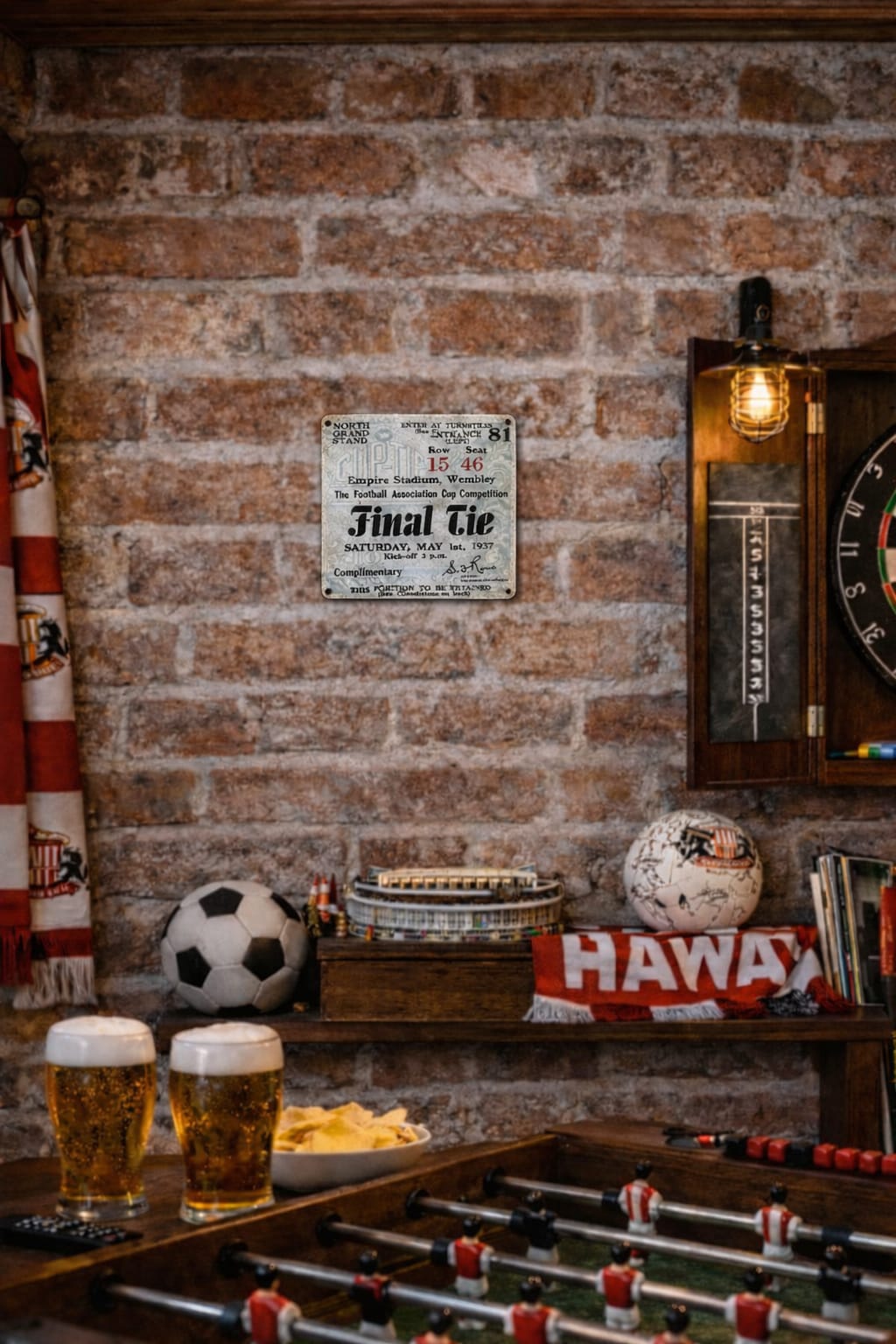 1937 FA Cup Final Ticket Metal sign in a Game room with foosball table, sports balls, and a dartboard on a brick wall.