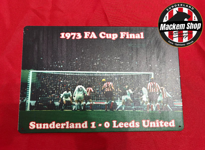 Metal sign commemorating the 1973 FA Cup Final between Sunderland and Leeds United on a red background.