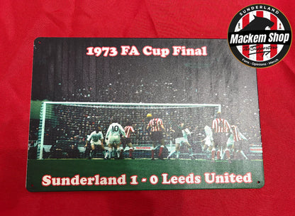 Metal sign commemorating the 1973 FA Cup Final between Sunderland and Leeds United on a red background.