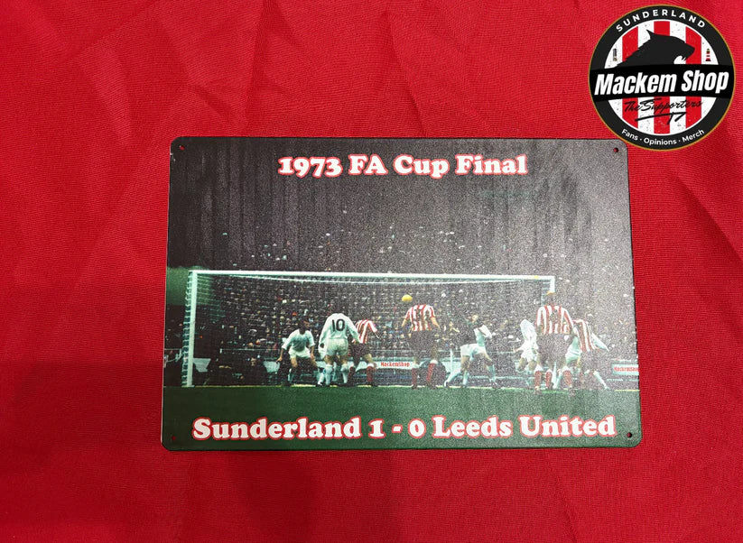 Metal sign with 1973 FA Cup Final result on a red background