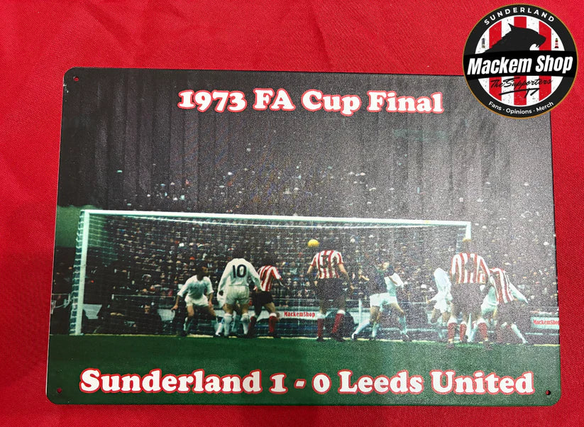 Metal sign commemorating the 1973 FA Cup Final between Sunderland and Leeds United on a red background.