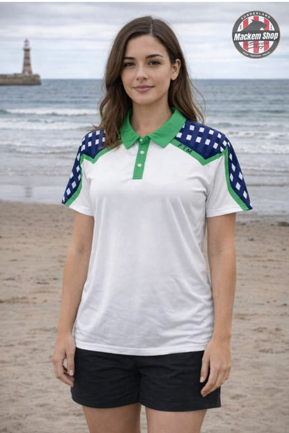 Woman wearing a white polo shirt with green and blue accents on a beach.