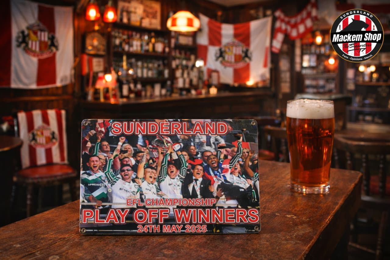 Metal sign celebrating Sunderland's EFL Championship Play Off Winners on a bar counter with a pint of beer.