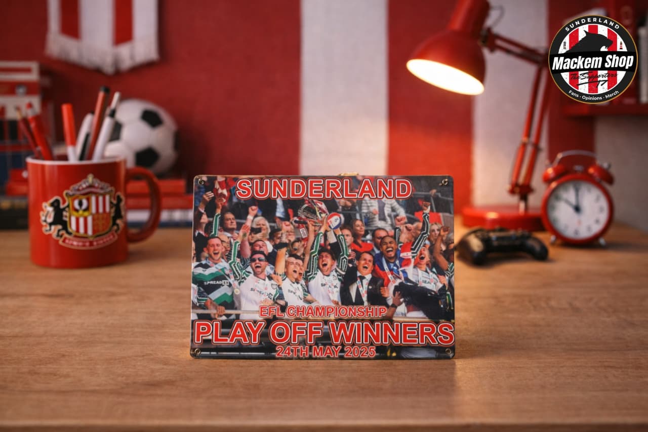 Metal sign celebrating Sunderland's EFL Championship Playoff Winners on a desk with sports-themed decor.