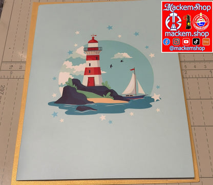 A square art print featuring a stylized lighthouse, sailboat, and stars on a pale blue background, photographed flat on a cutting mat with a red MackemShop logo sticker in the top right corner.