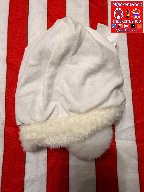 A white plush hat with a fluffy cream trim, laid flat on a red and white striped background with a MackemShop logo on the right side.