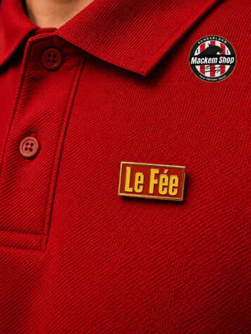 Red polo shirt with 'Le Fée' Lapel pin and Mackem Shop logo on top right corner.