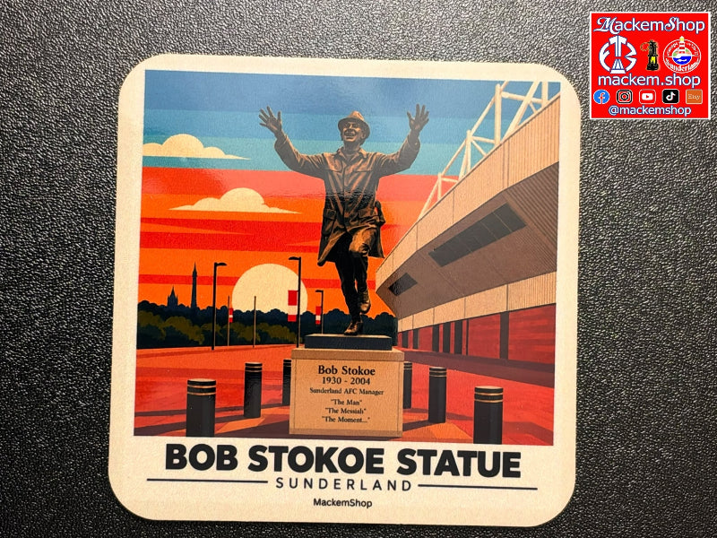 A square printed coaster featuring an illustrated view of the Bob Stokoe Statue in Sunderland, with a statue, stadium, and sunset sky. The text 'BOB STOKOE STATUE SUNDERLAND' appears at the bottom, and a MackemShop logo appears in the top-right corner of the image.