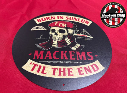 Circular logo with skull design and text on a red background, featuring the 'Mackem Shop' brand.