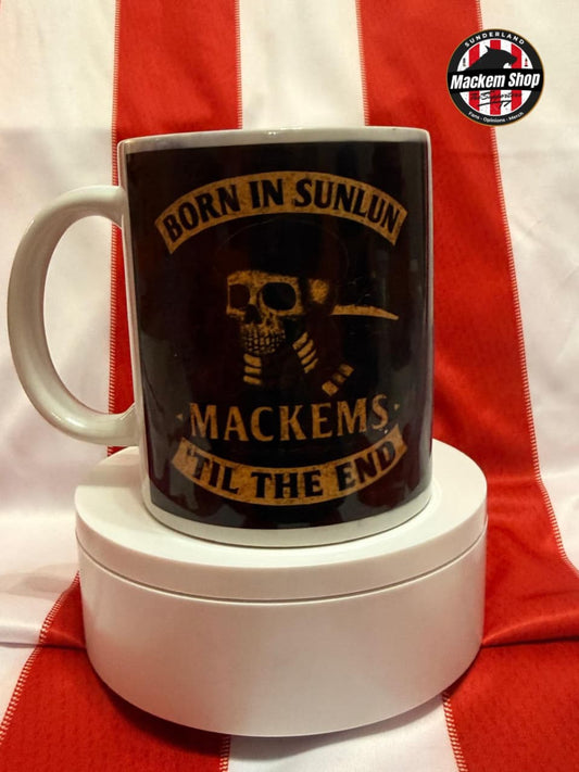 Mug with skull design and text on a white and red striped background