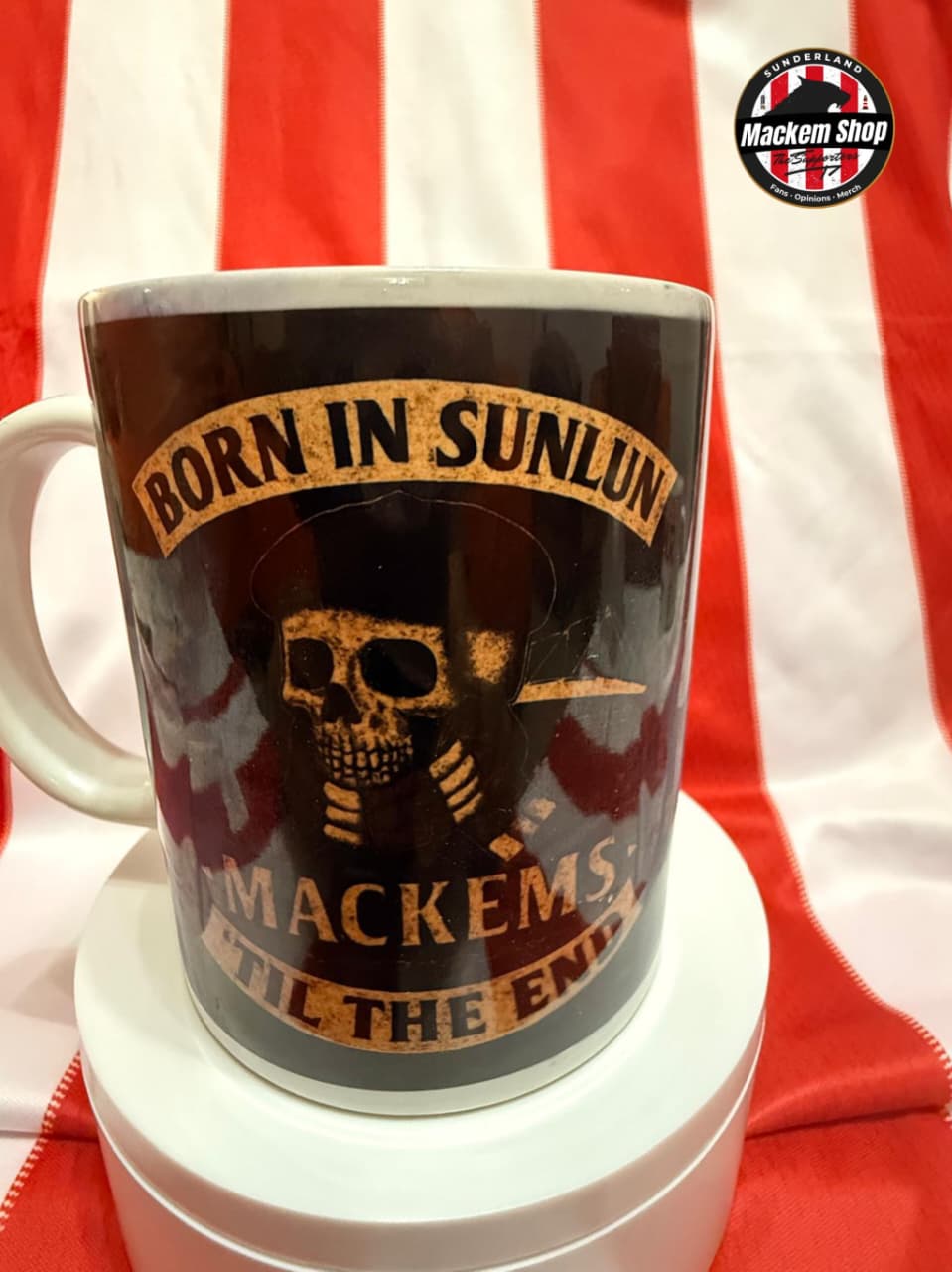 Mug with 'Born in Sunlun Mackems' design on a red and white striped background