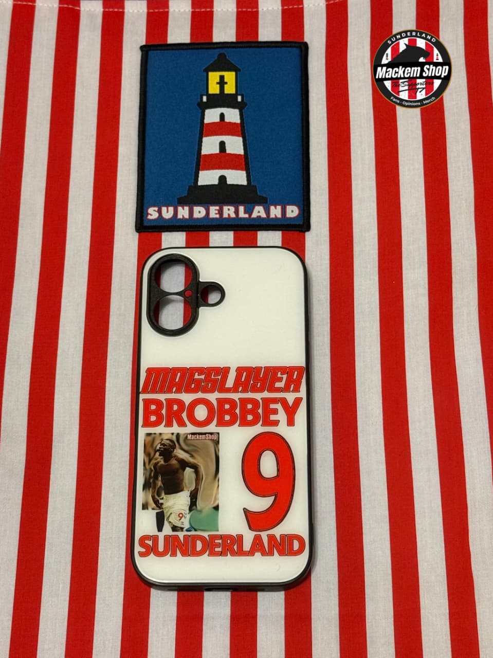Phone case with Sunderland lighthouse design on a red and white striped background