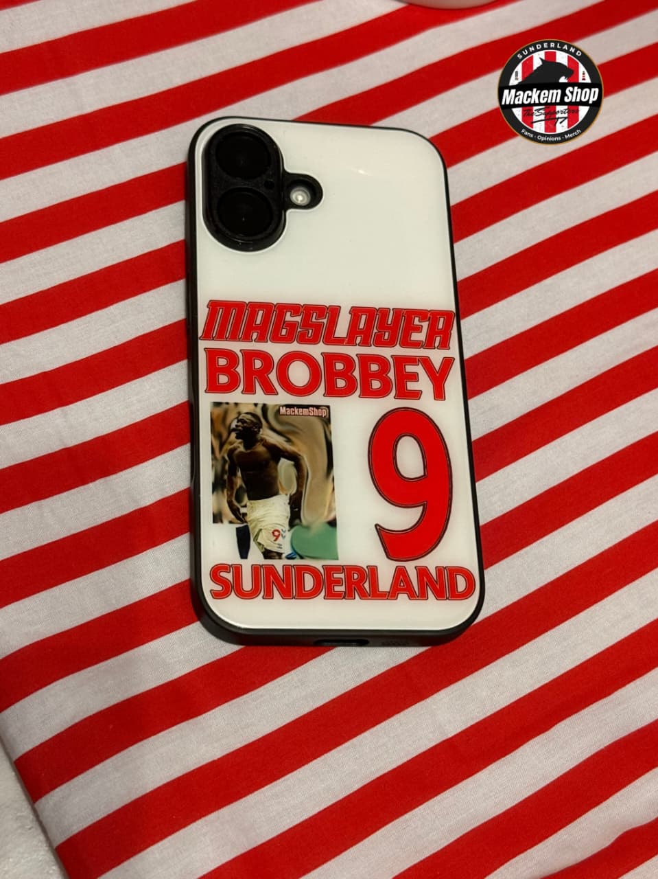 Phone case with text and a photo on a red and white striped background
