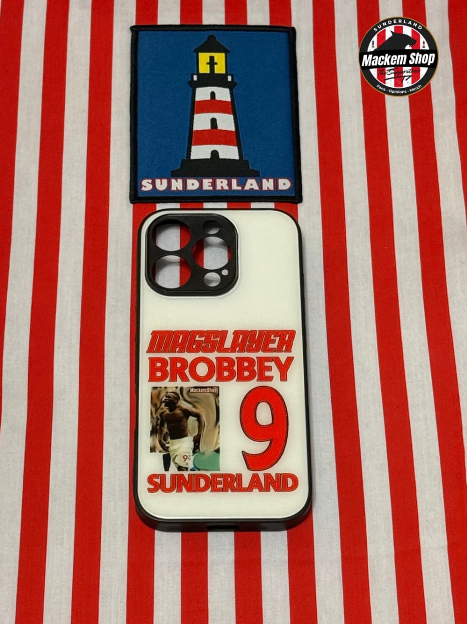 Phone case with Sunderland lighthouse design and text on a red and white striped background