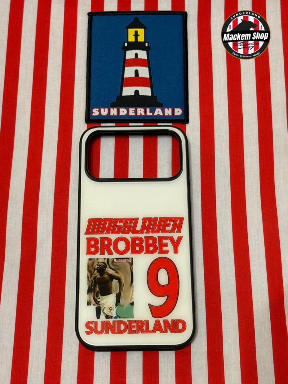 Patch with lighthouse design and text on a red and white striped background