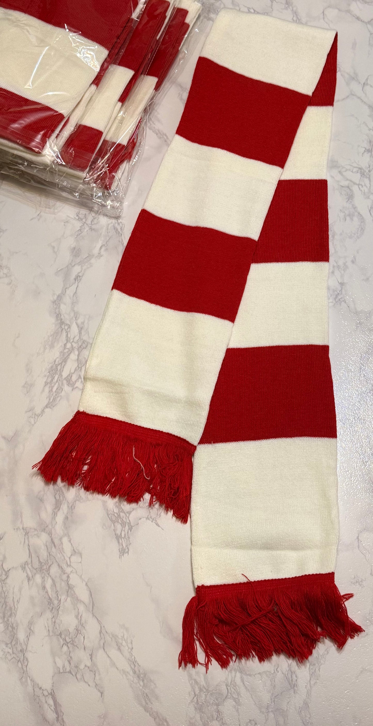 Red and white striped scarf with fringes