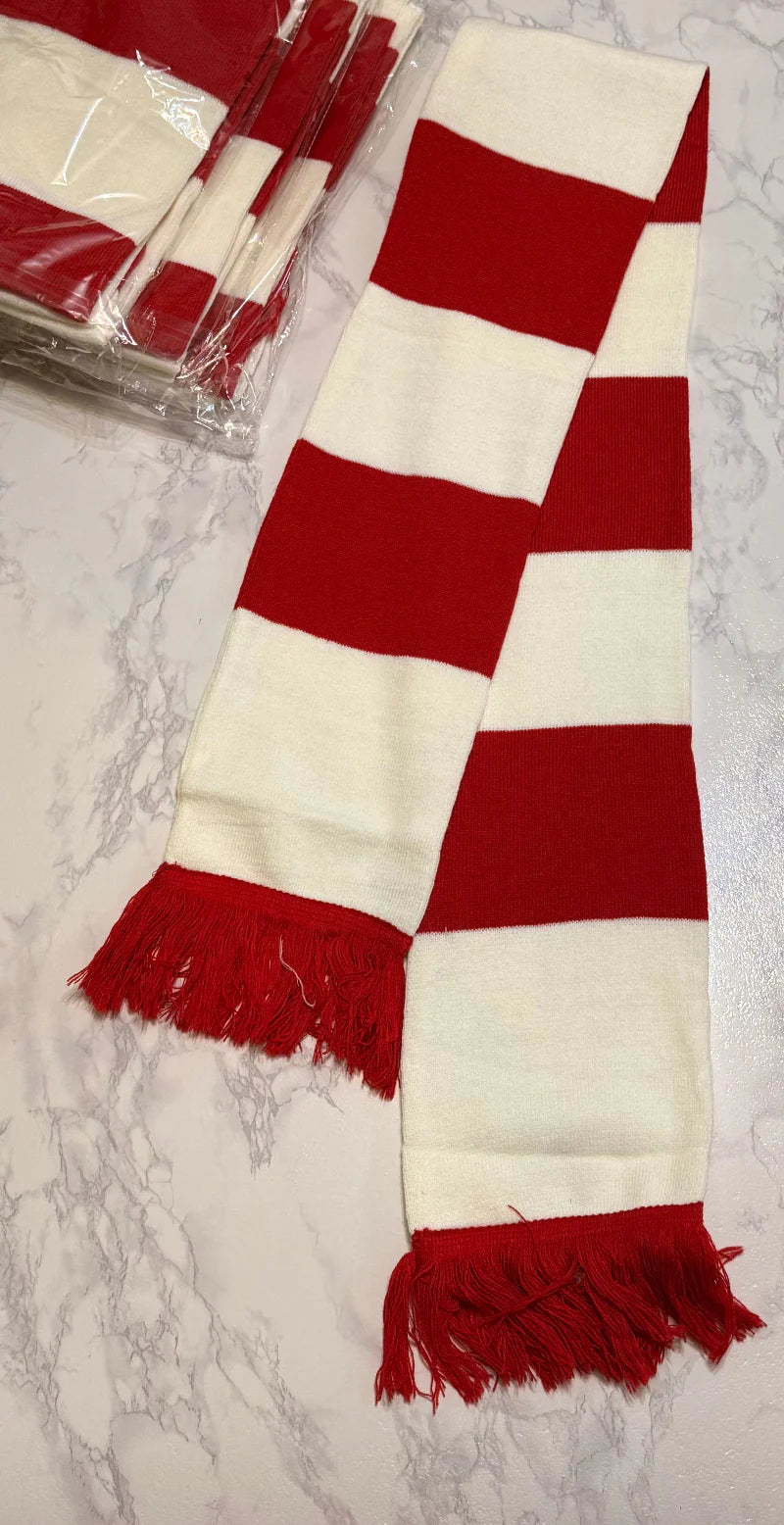 Red and white checkered scarf with fringed ends on a marble surface