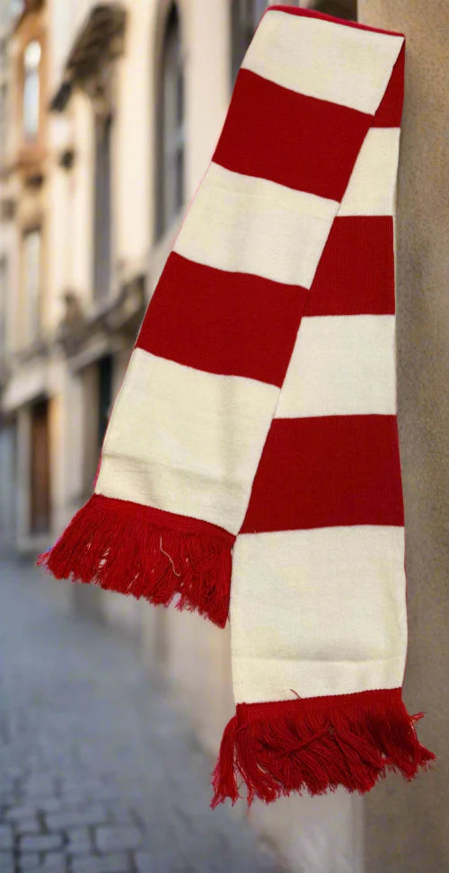 Red and white checkered scarf with fringes on a blurred street background
