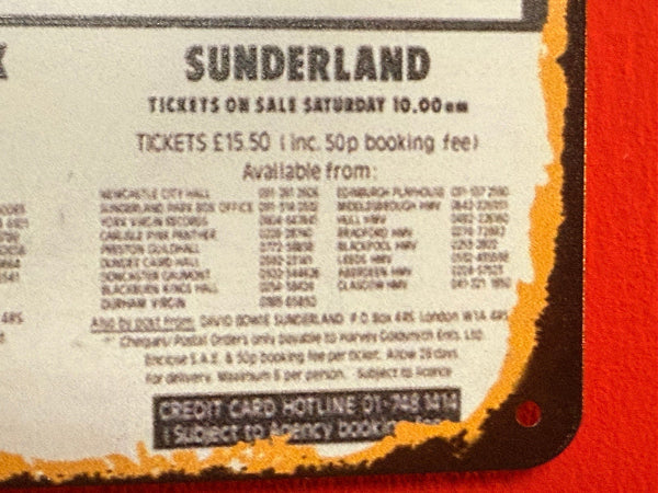 Sunderland tickets on sale information with contact details on a textured surface.