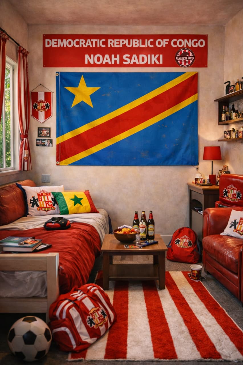 Room interior with a large flag of the Democratic Republic of Congo on the wall, featuring the name Noah Sadiki.