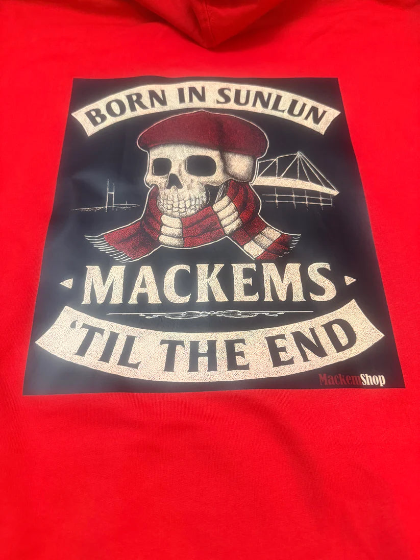 Red t-shirt with a graphic design featuring a skull wearing a red cap and scarf, text 'Born in Sunlun Mackems til the end', and a logo in the corner.