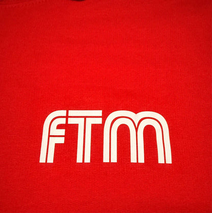 Red shirt with 'FTM' logo in white