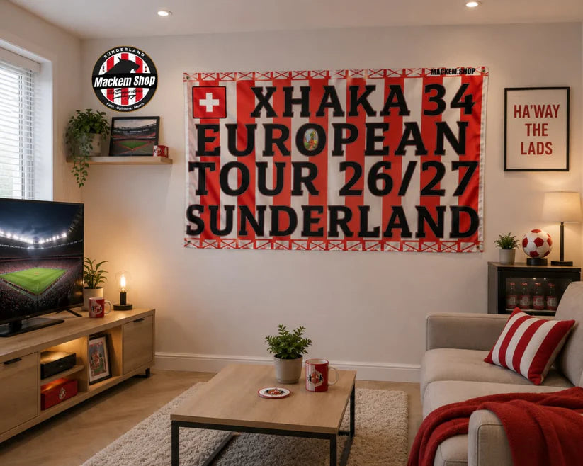 Living room with a large banner featuring 'Xhaka 34 European Tour 26/27 Sunderland' on the wall.
