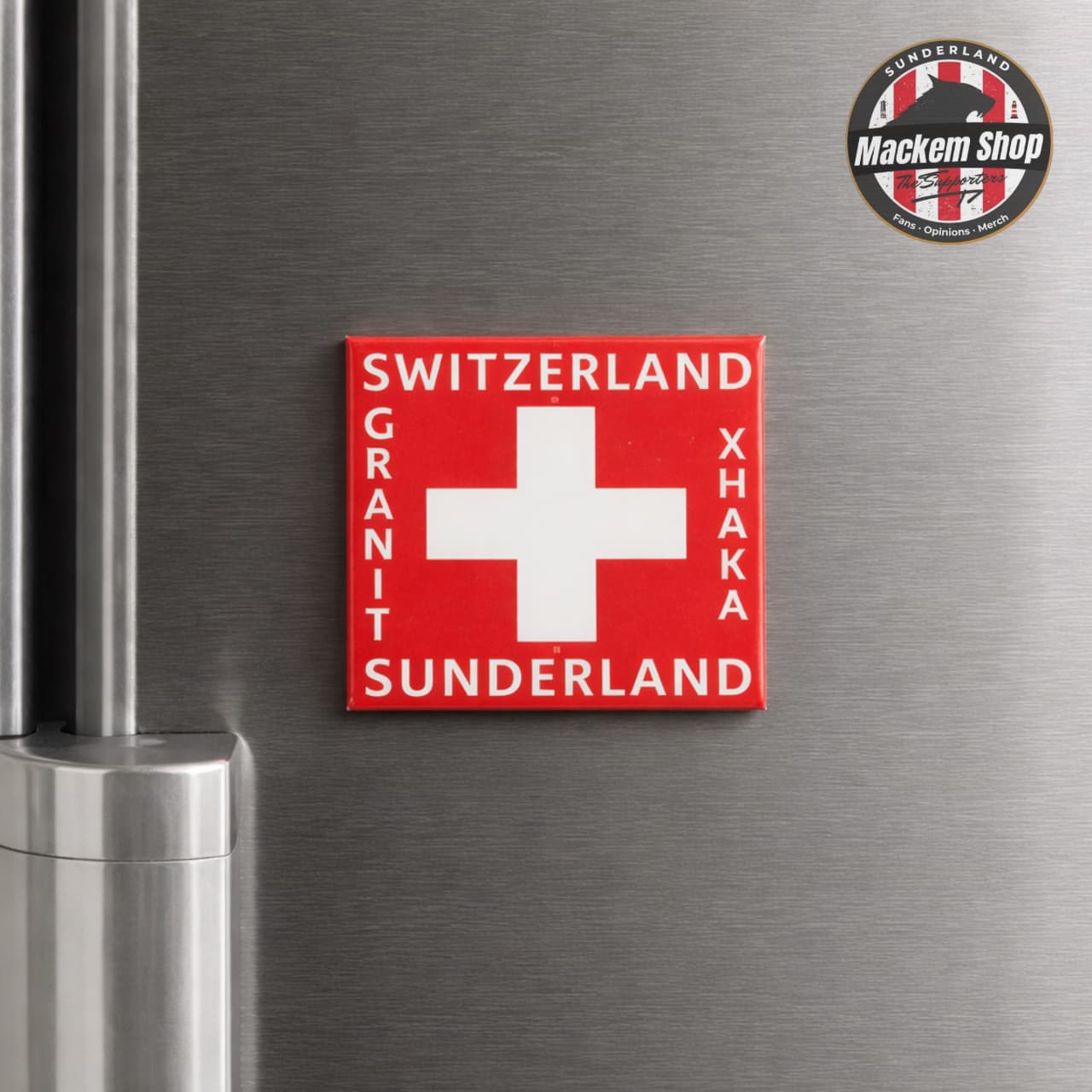 Fridge magnet with Swiss flag design and text on a metallic surface, with 'Mackem Shop' logo above.