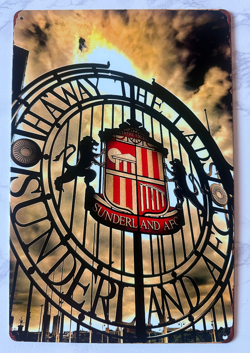 Metal sign with Sunderland AFC logo and text against a sunset background