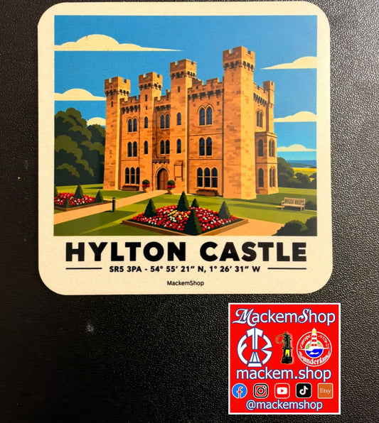 A coaster with Hylton Castle illustration on a black surface. 