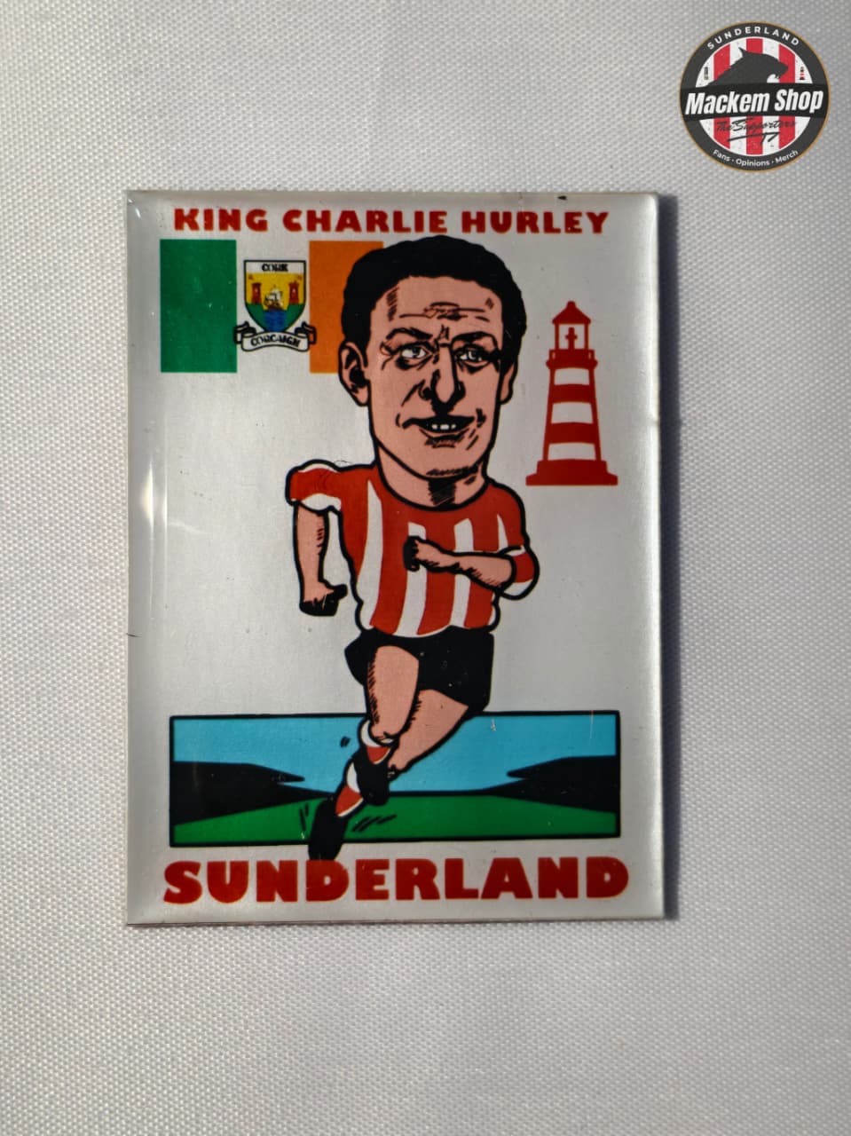 Fridge magnet with King charlie hurley character and text on a gray background