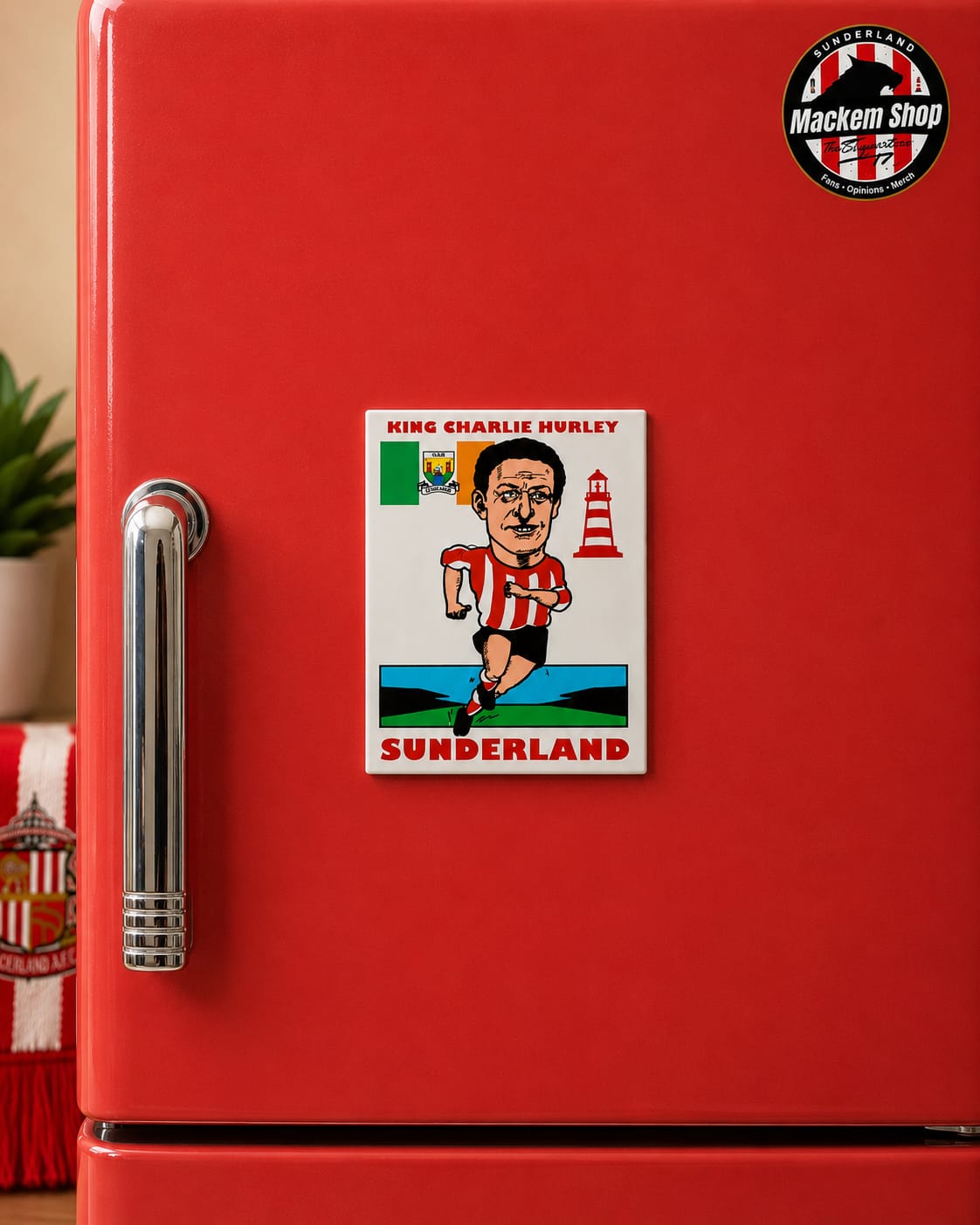 Red refrigerator with a Sunderland football club magnet featuring a caricature of a player.