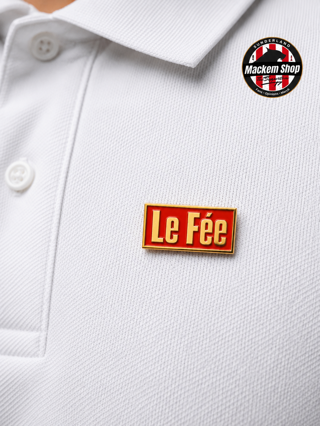 White polo shirt with a red 'Le Fée' badge on the chest, featuring MackemShop logo in the top right corner.