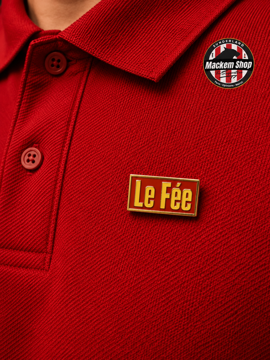 Red polo shirt with 'Le Fée' Badge and Mackem Shop logo.