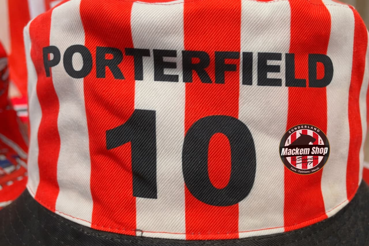 Red and white striped cap with 'Porterfield 10' printed on it, featuring a logo in the corner.