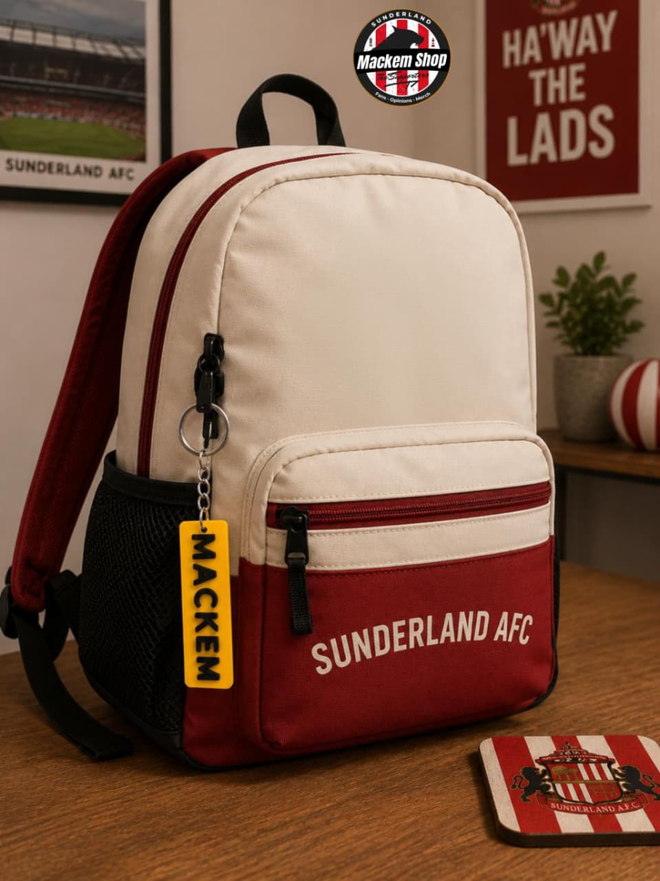 Backpack with Sunderland AFC branding with Mackem Keychain on it, on a wooden surface, with a blurred background.