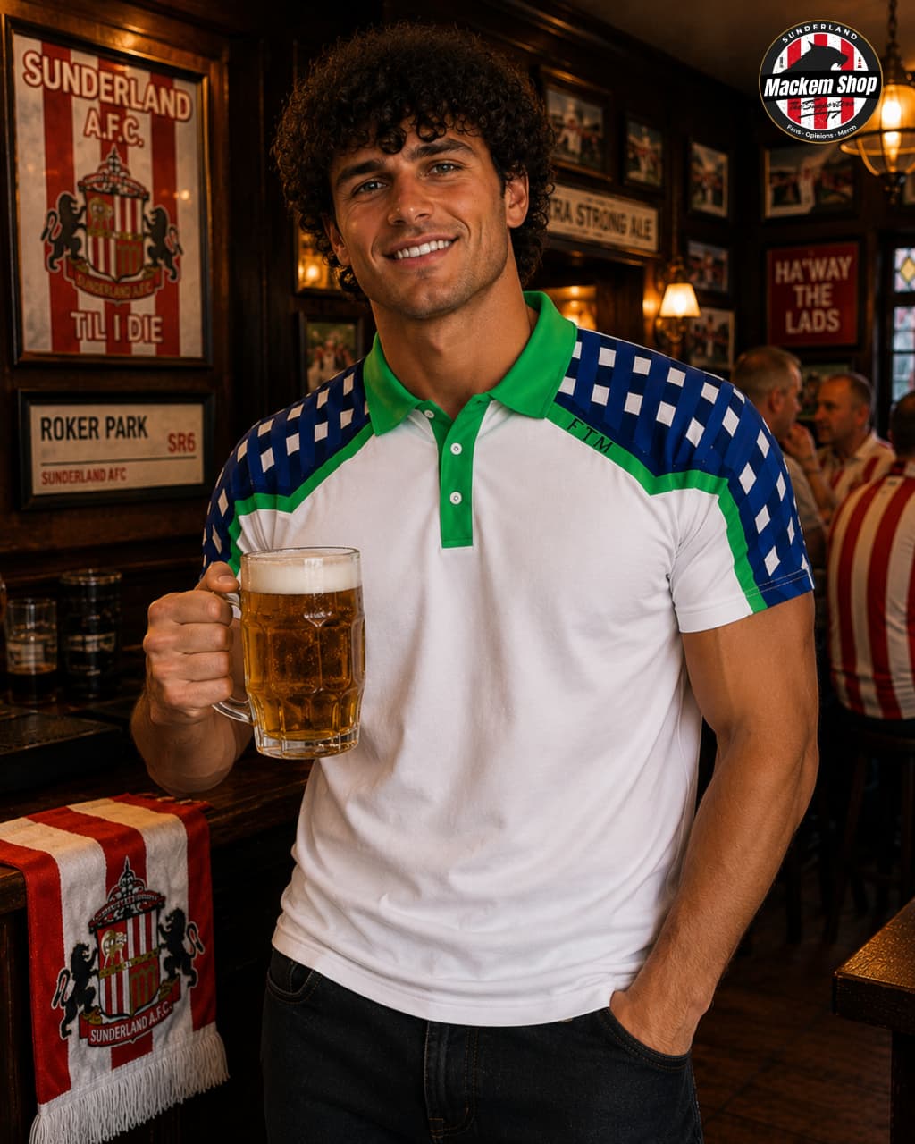 A smiling man in a pub holding a large mug of beer, wearing a white short-sleeve polo shirt with green and blue checkered shoulder panels. The background shows wooden walls, framed Sunderland A.F.C.