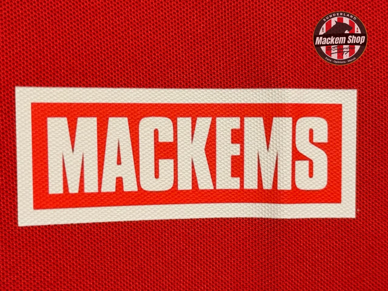 Red fabric background with 'Mackems' logo and Mackem Shop logo.