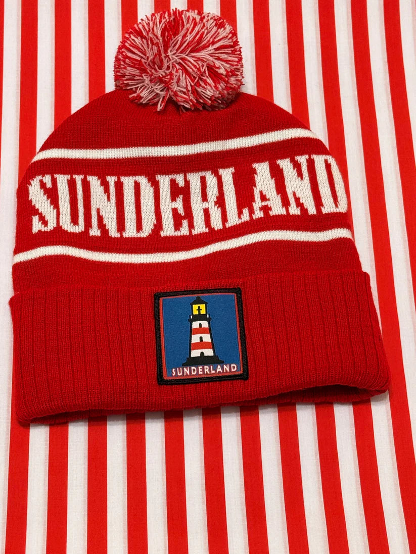 Red beanie with 'Sunderland' text and logo on a red and white striped background