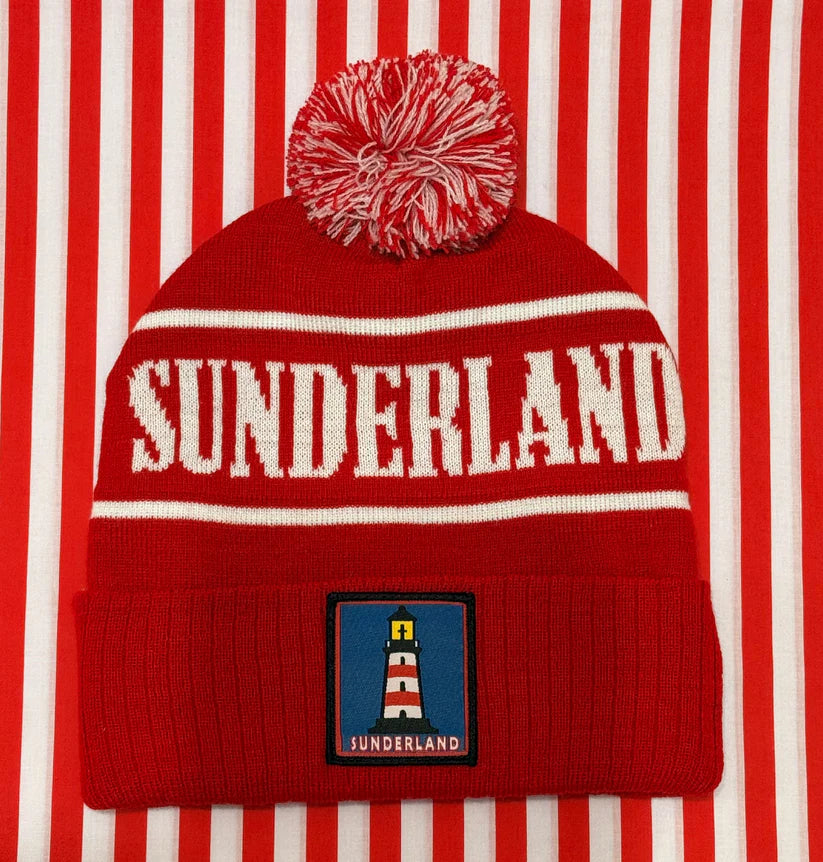 Red beanie with 'Sunderland' text on a red and white striped background